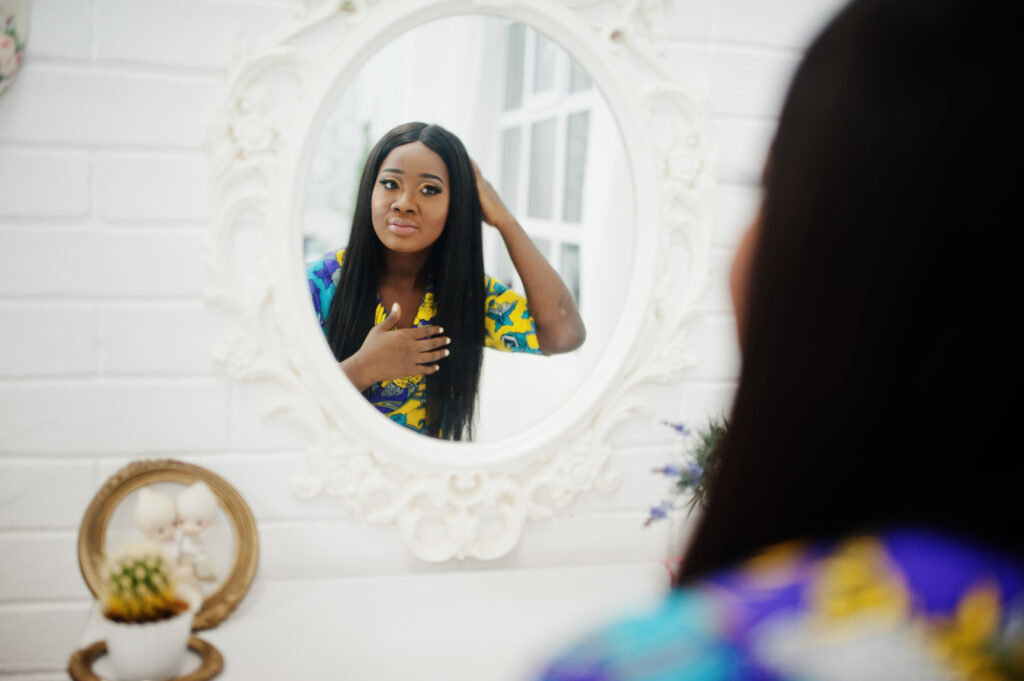 Woman looking into a mirror